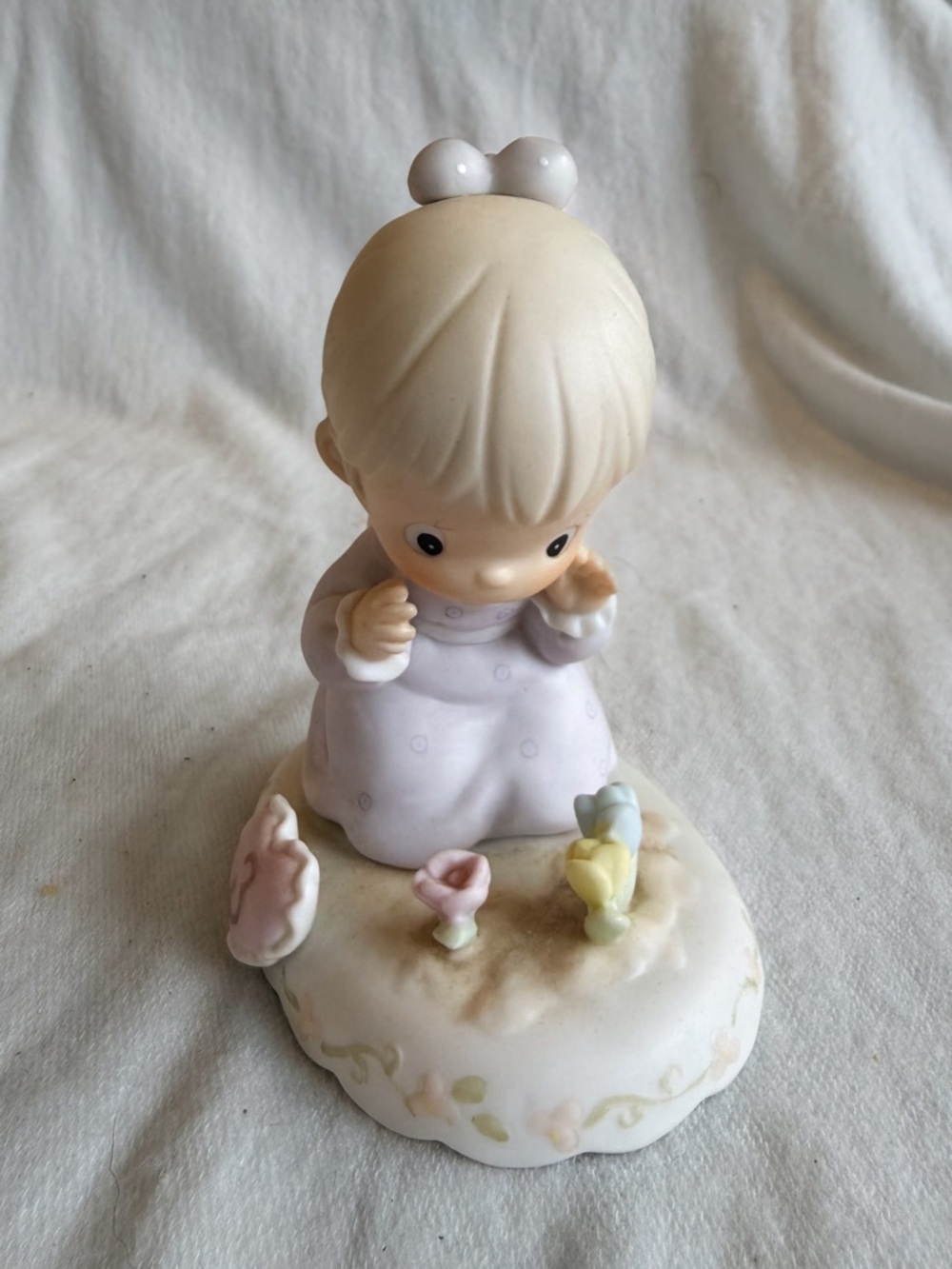 Precious Moments Figurine in Pastel Purple, Cream, Pink and Yellow